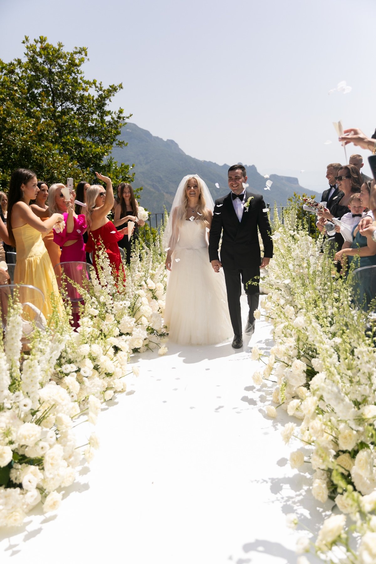 white flower lined ceremony aisle