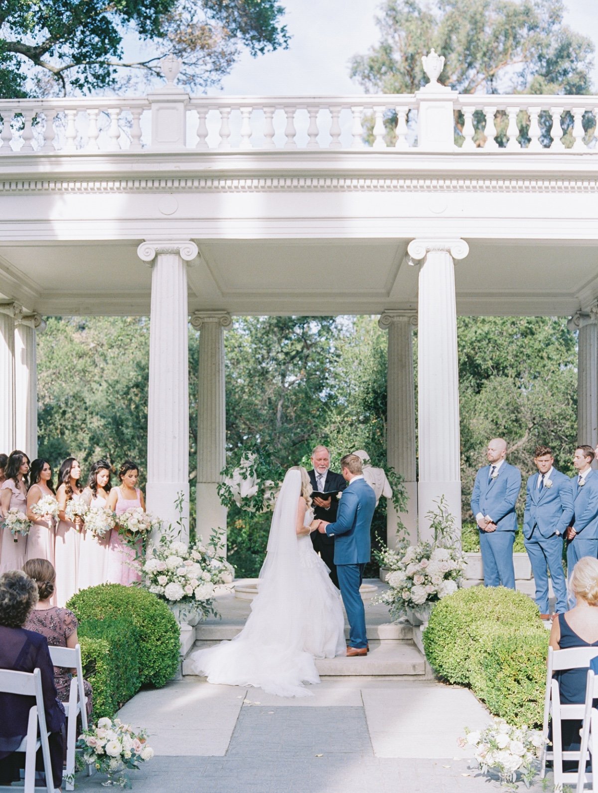 all white ceremony floral arrangements