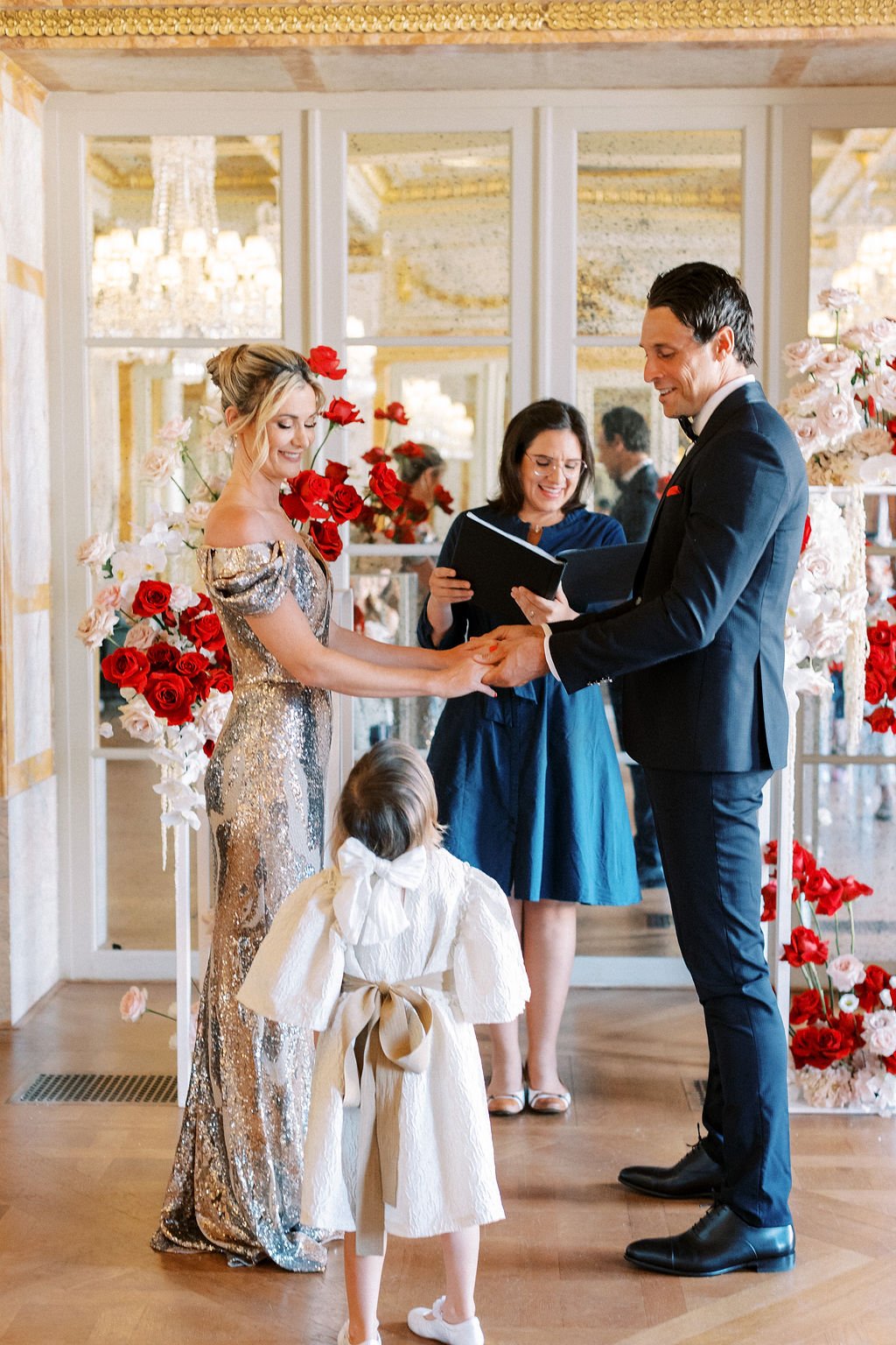 Adorable daughter of bride and groom interrupting ceremony 