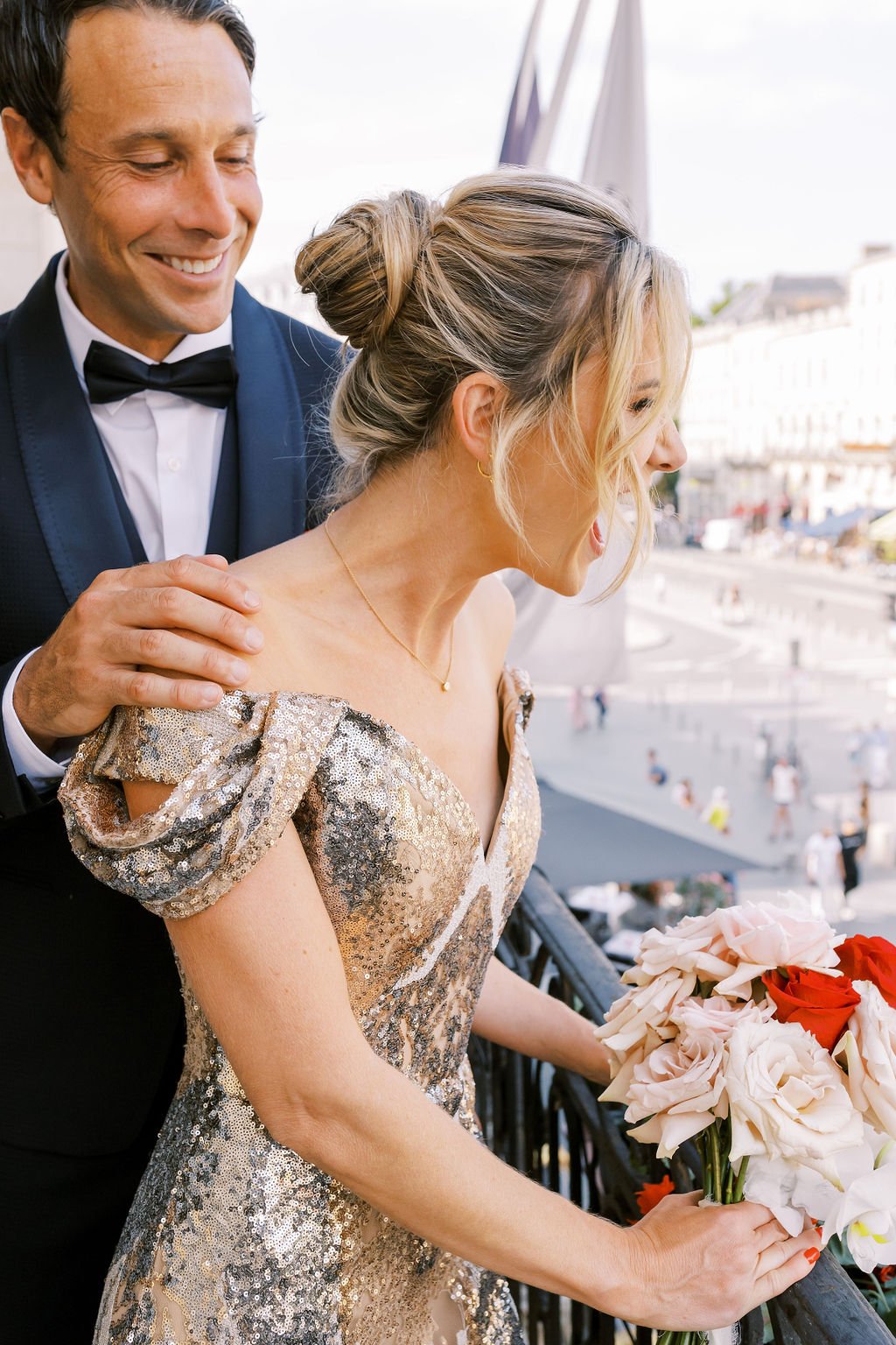 Luxury French elopement couple cheering to city plaza 