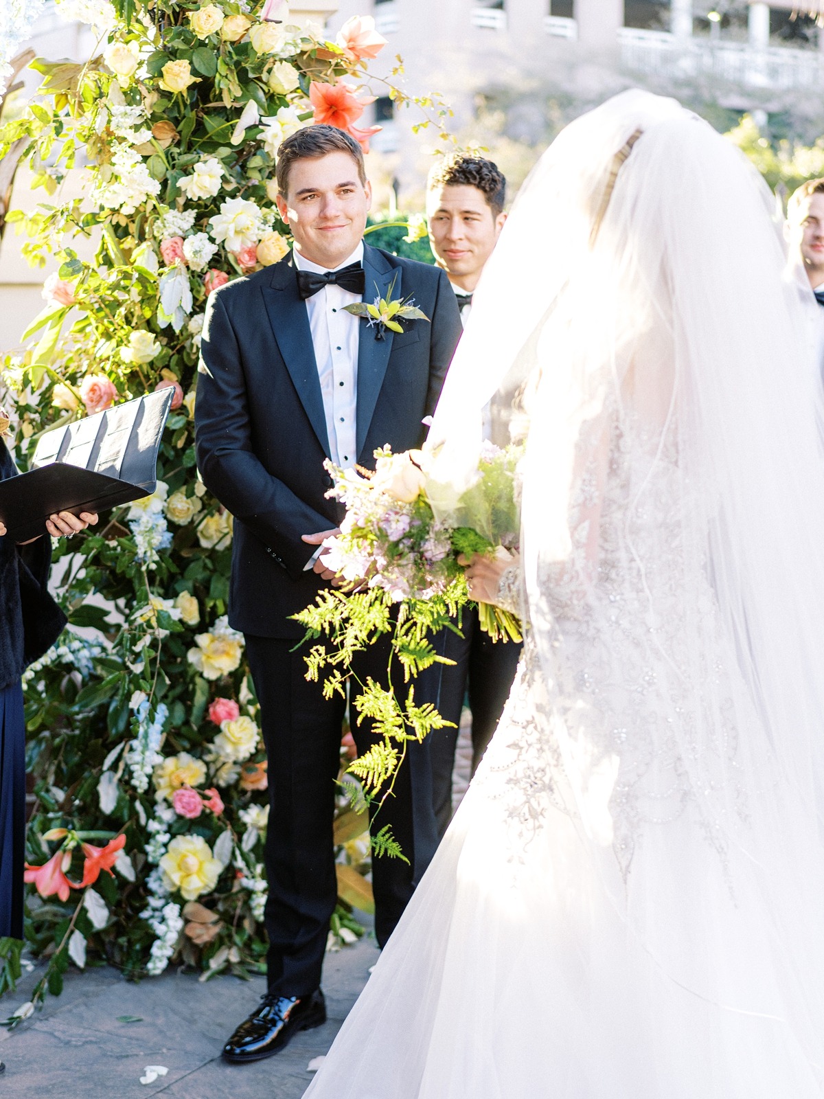 classic black tux with yellow boutonniere