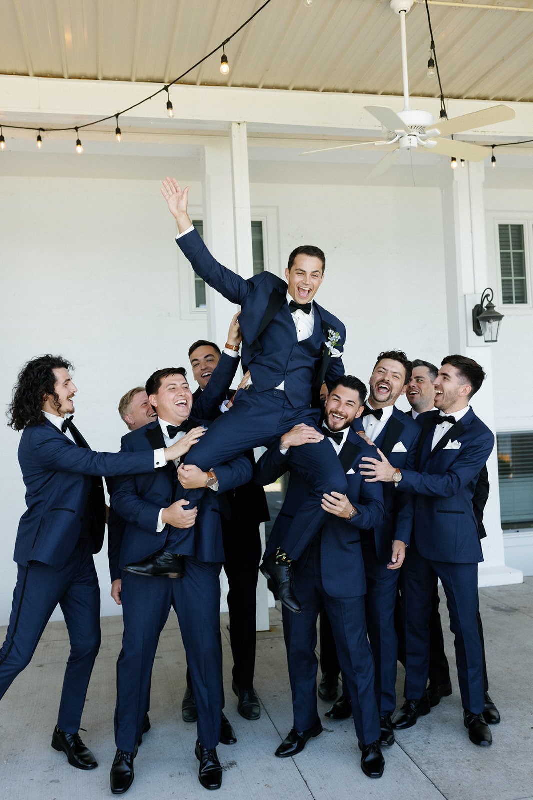 navy suits with black bowties