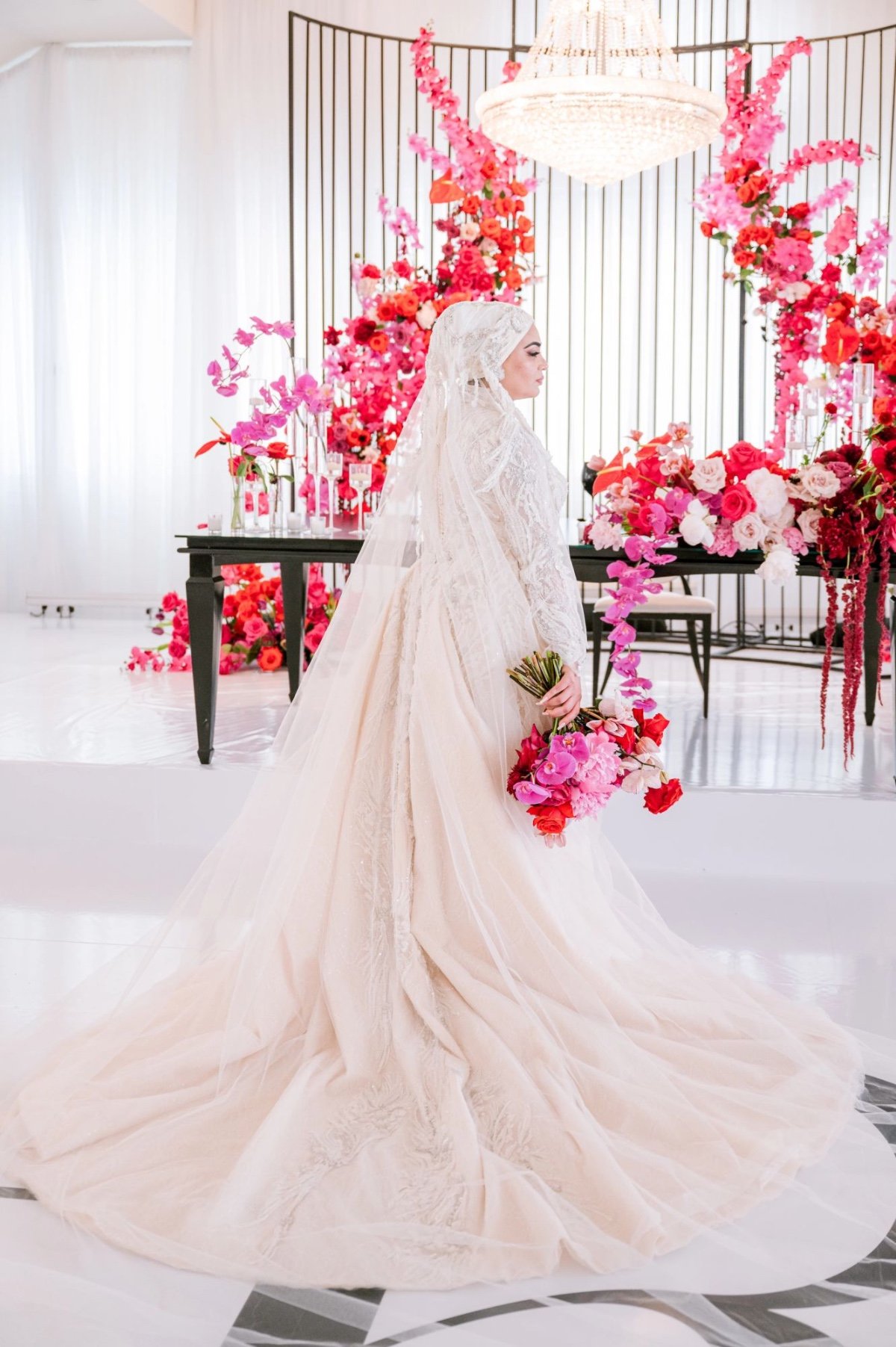 muslim bride in champagne wedding gown with pink red and fuchsia