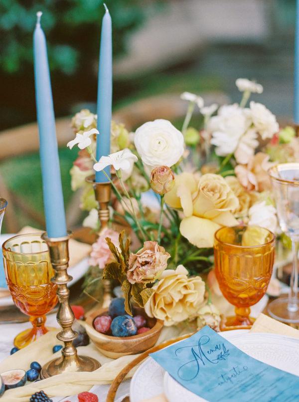 vintage wine glasses and berry accents on the reception table