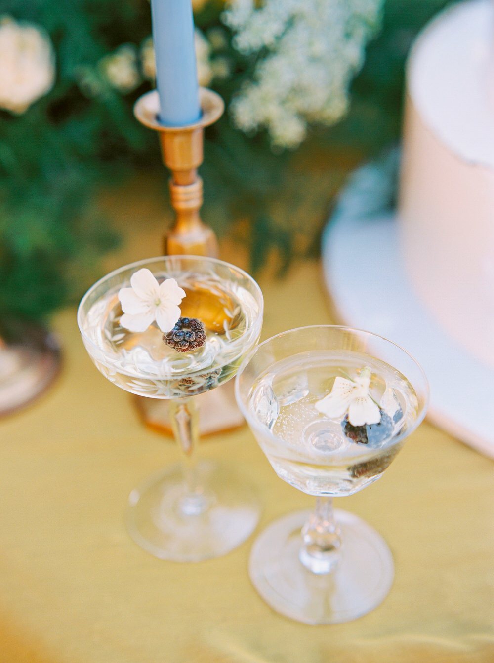 specialty cocktails with floating floral accents