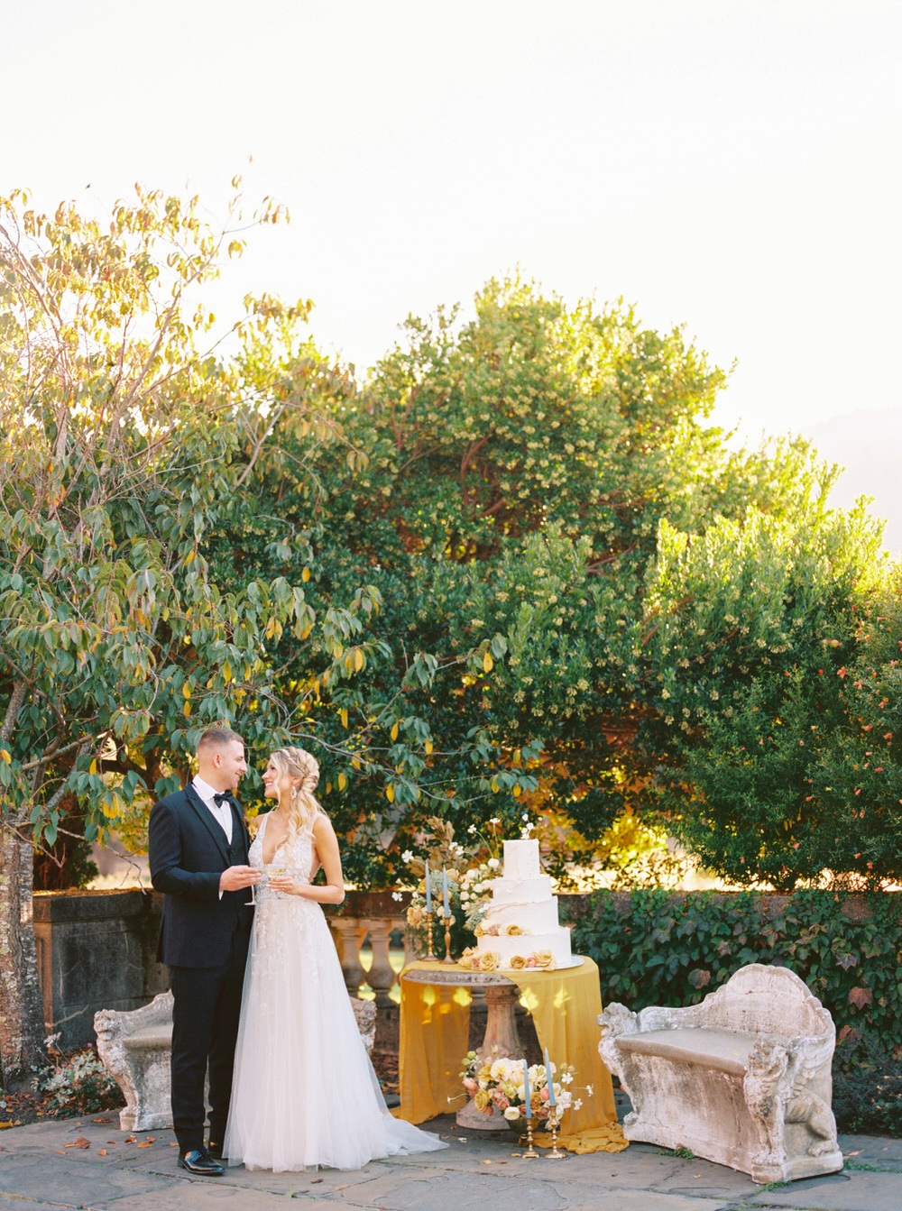 bride and groom get read to cut the cake