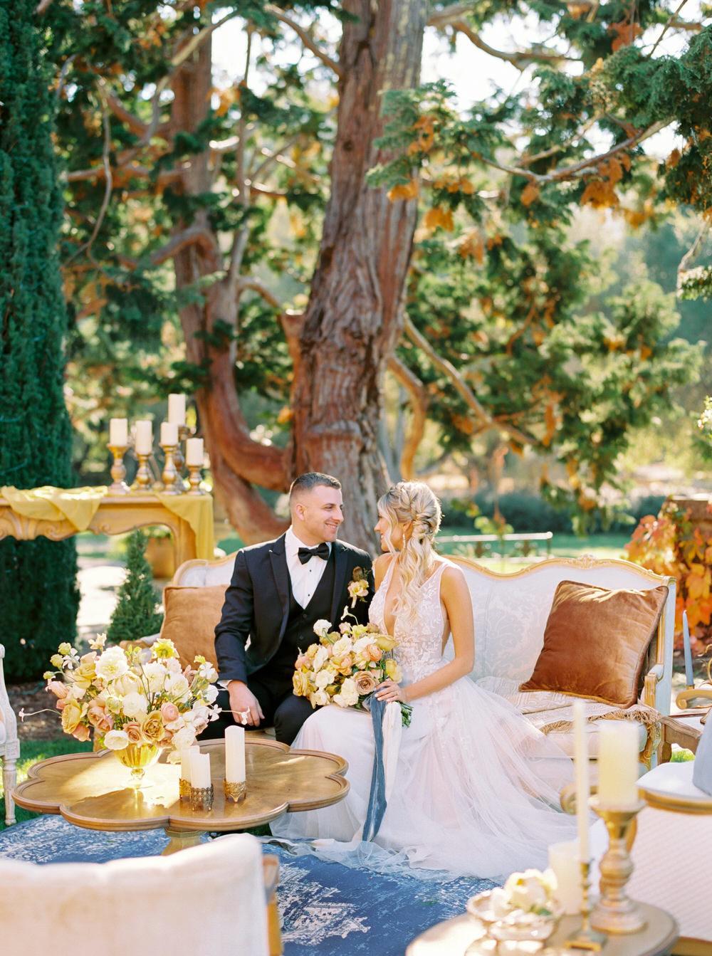 bride and groom smile at each other during their cocktail hour in Filoli gardens