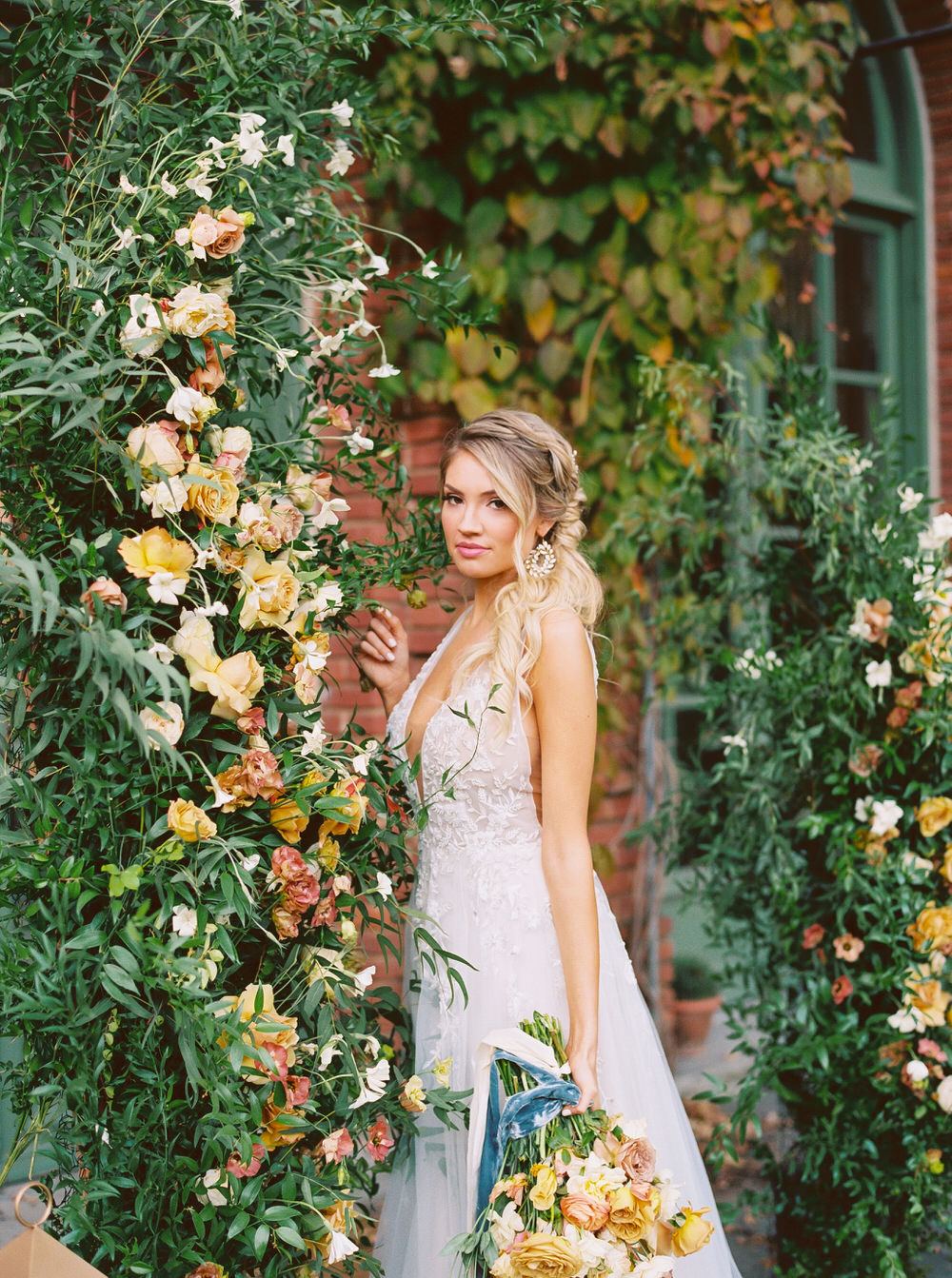 bridal portrait by the rose floral installation