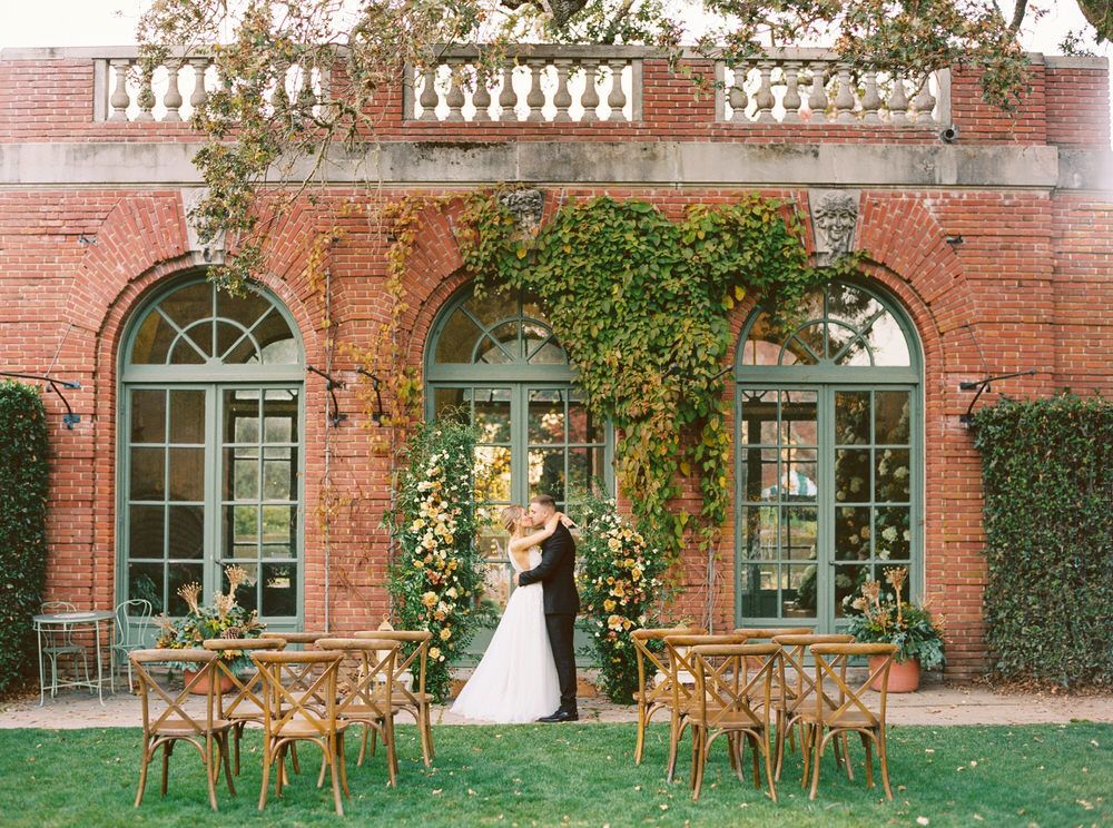 asymmetrical rose arch at the ceremony in Filoli Gardens