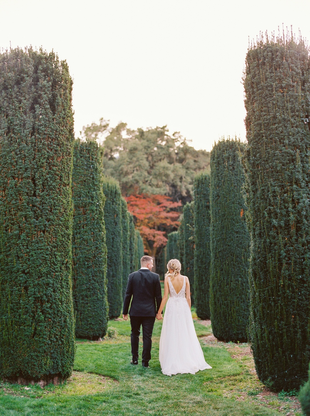 couple walks through the gardens in California