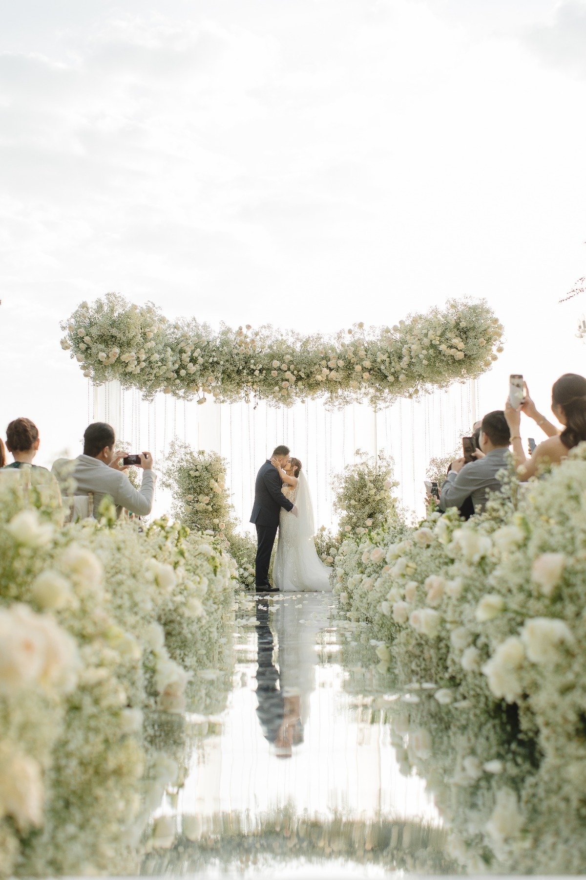 floating baby's breath and white rose arch