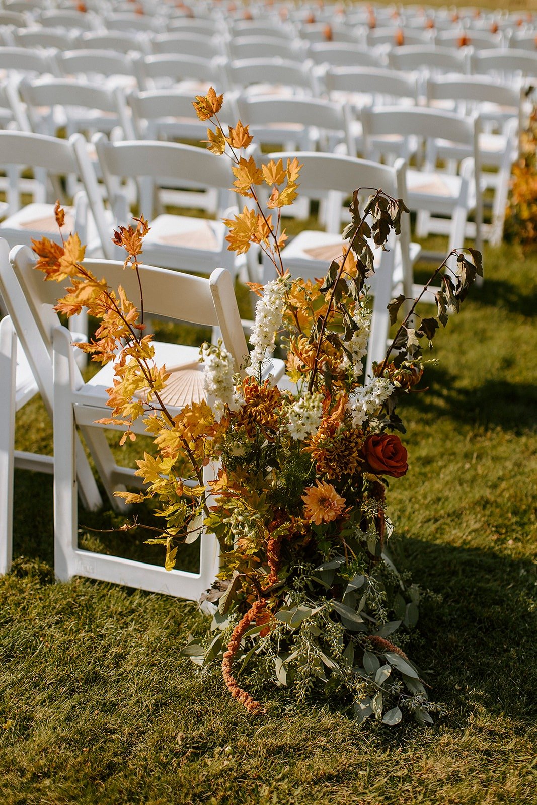 fall wedding flowers for outdoor ceremony with dried leaves