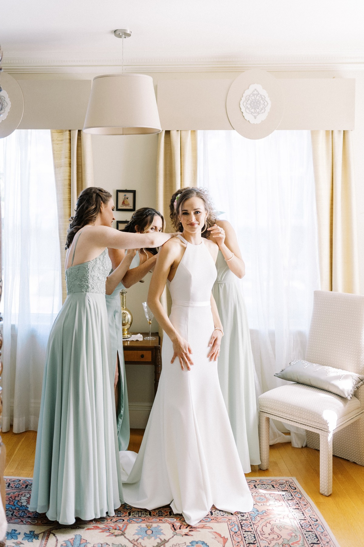 bride getting ready bridesmaids in mint