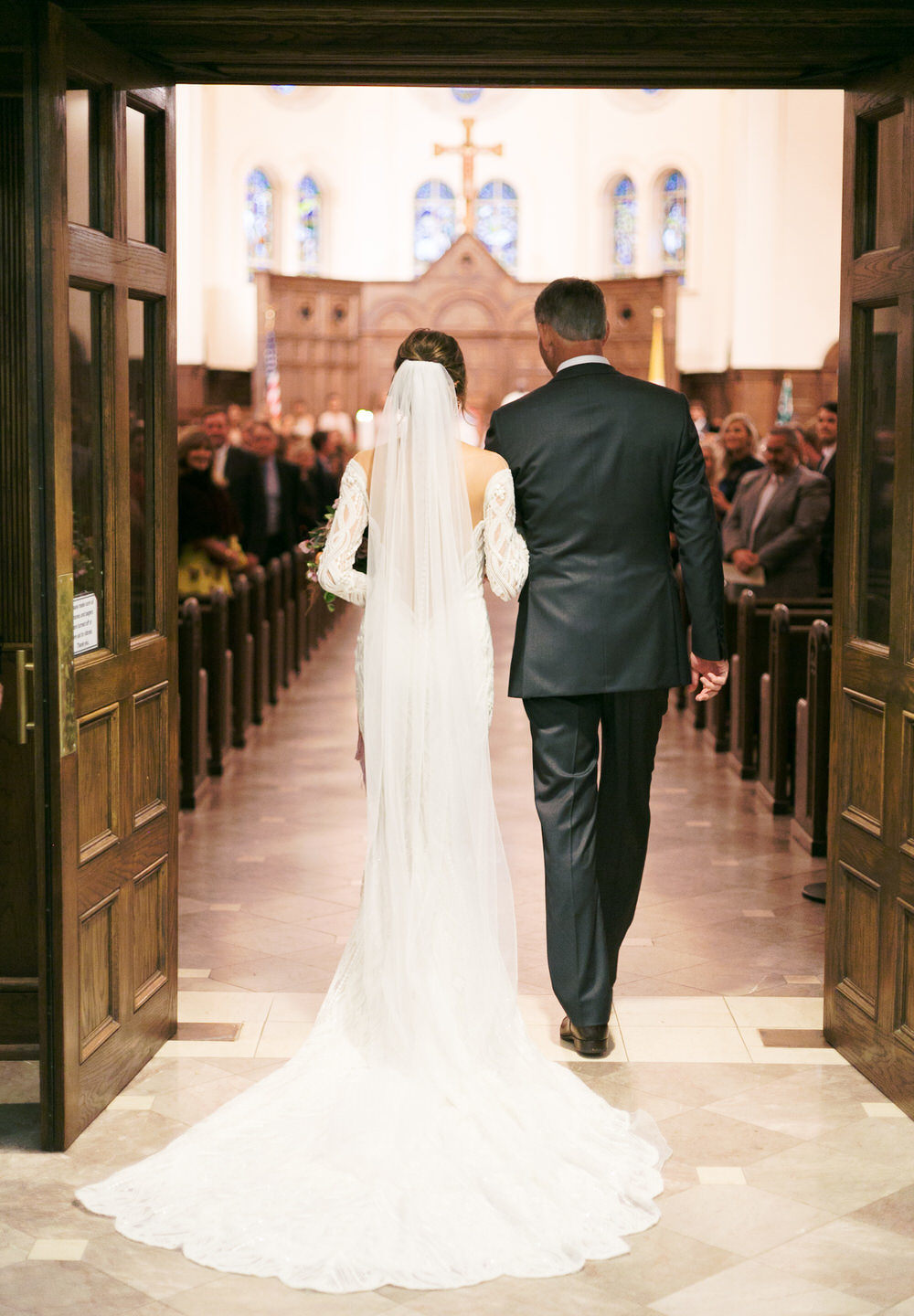 bride getting ready to walk down the aisle with her dad