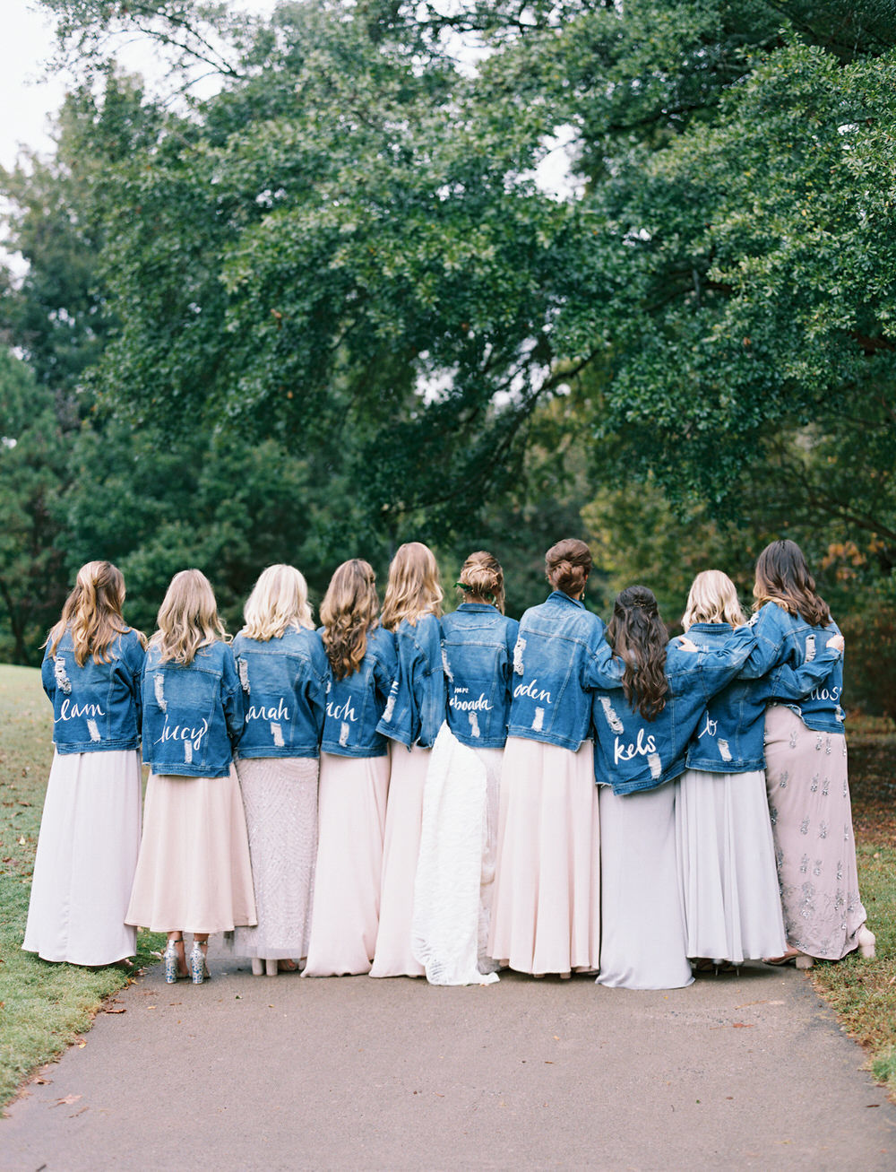 bride and her bridesmaids wearing custom jean jackets