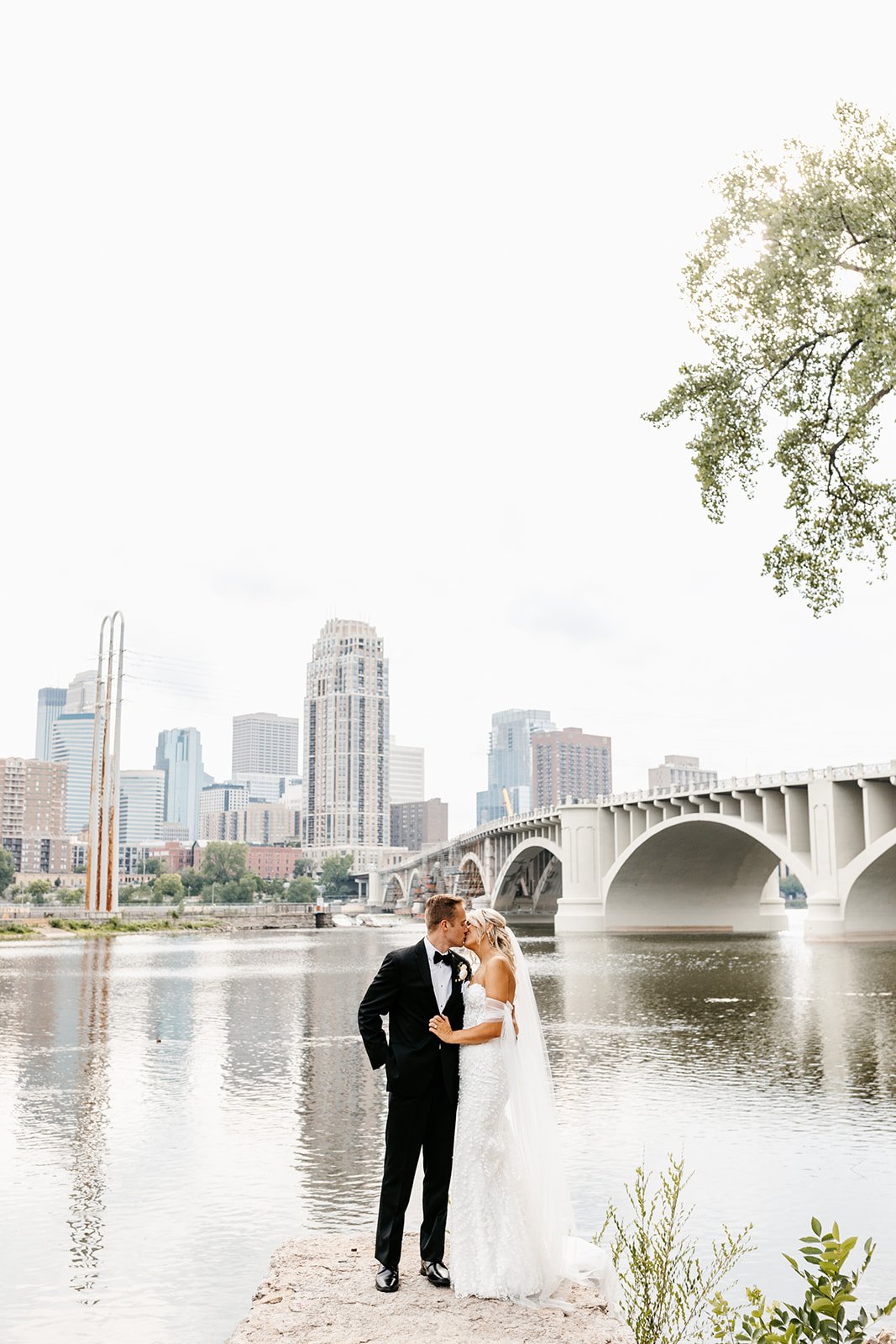 bride and groom in Minneapolis on river front