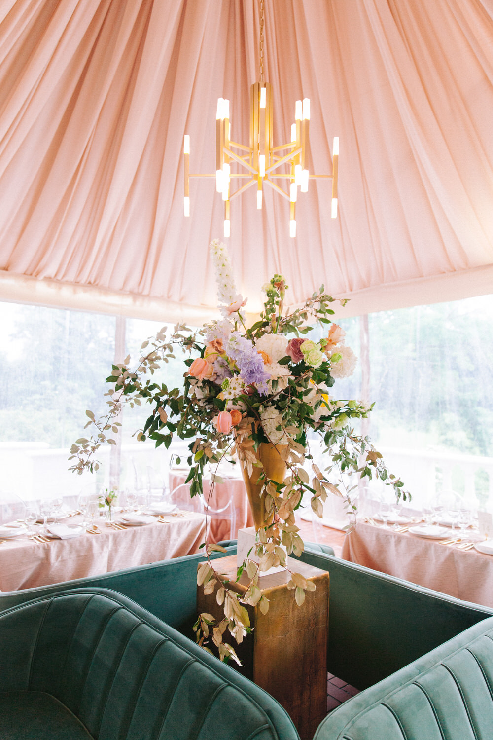 blush ceiling draping with velvet seating area