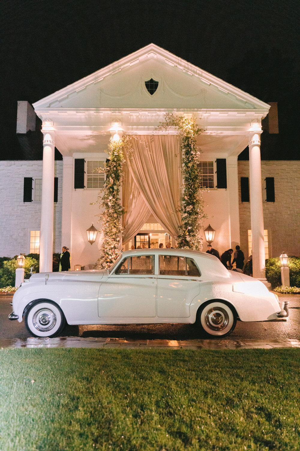 vintage get-away car in front of massive southern reception entrance