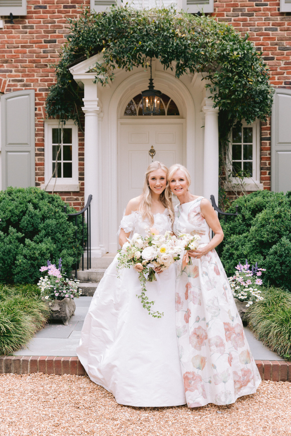 bride and mother of the bride in a glam floral gown