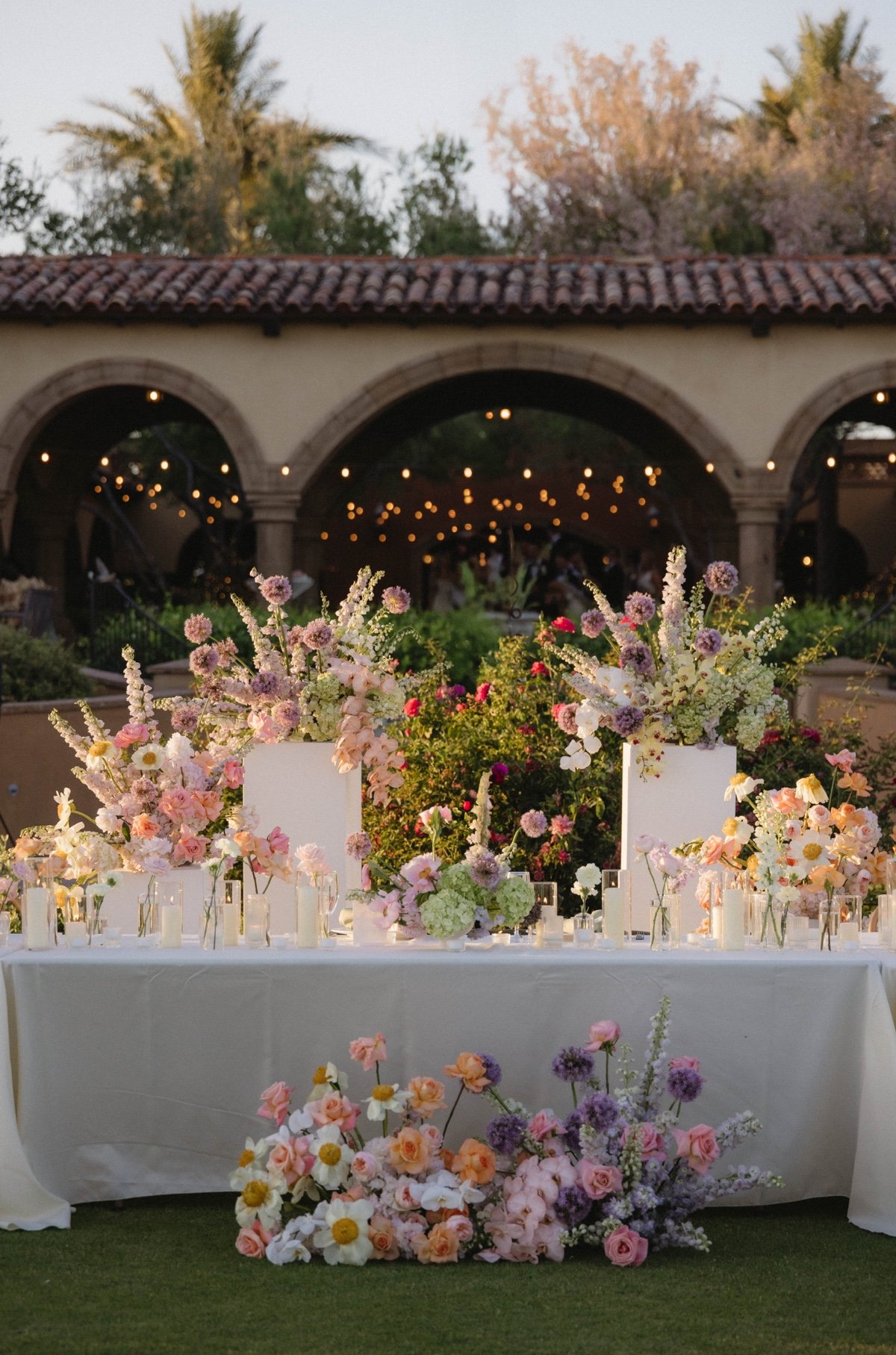 whimsical pastel floral arrangements for garden wedding reception