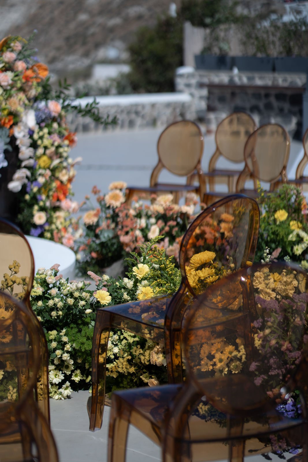 brown ghost chairs for wedding ceremony