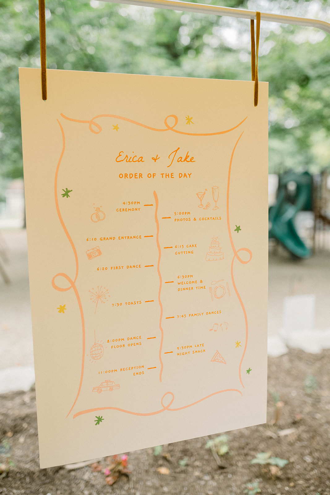 peach and orange order of day sign for wedding