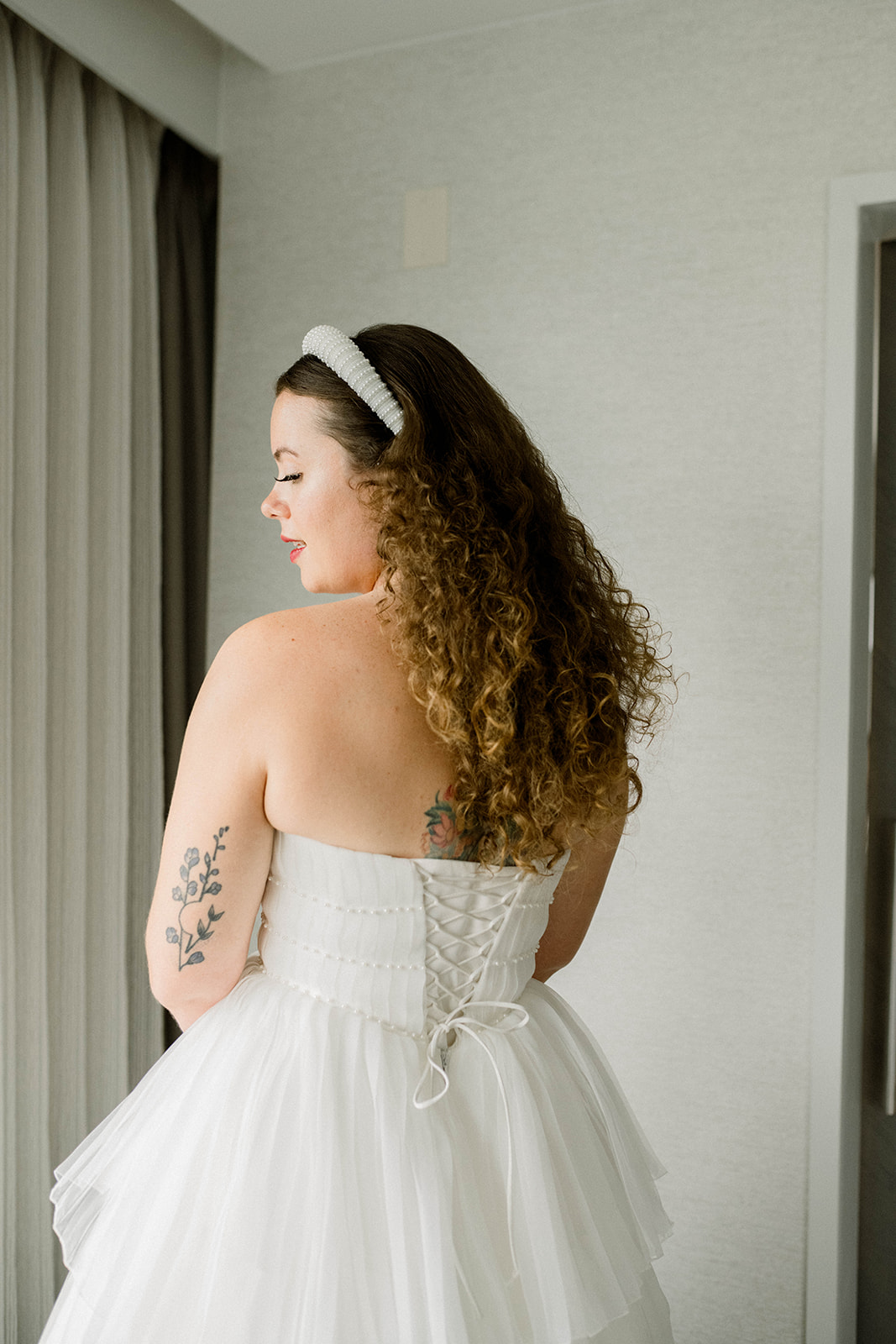 bride in lace up wedding dress