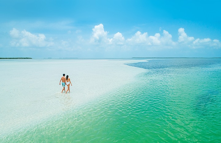 couple on a sandbar in the florida keys