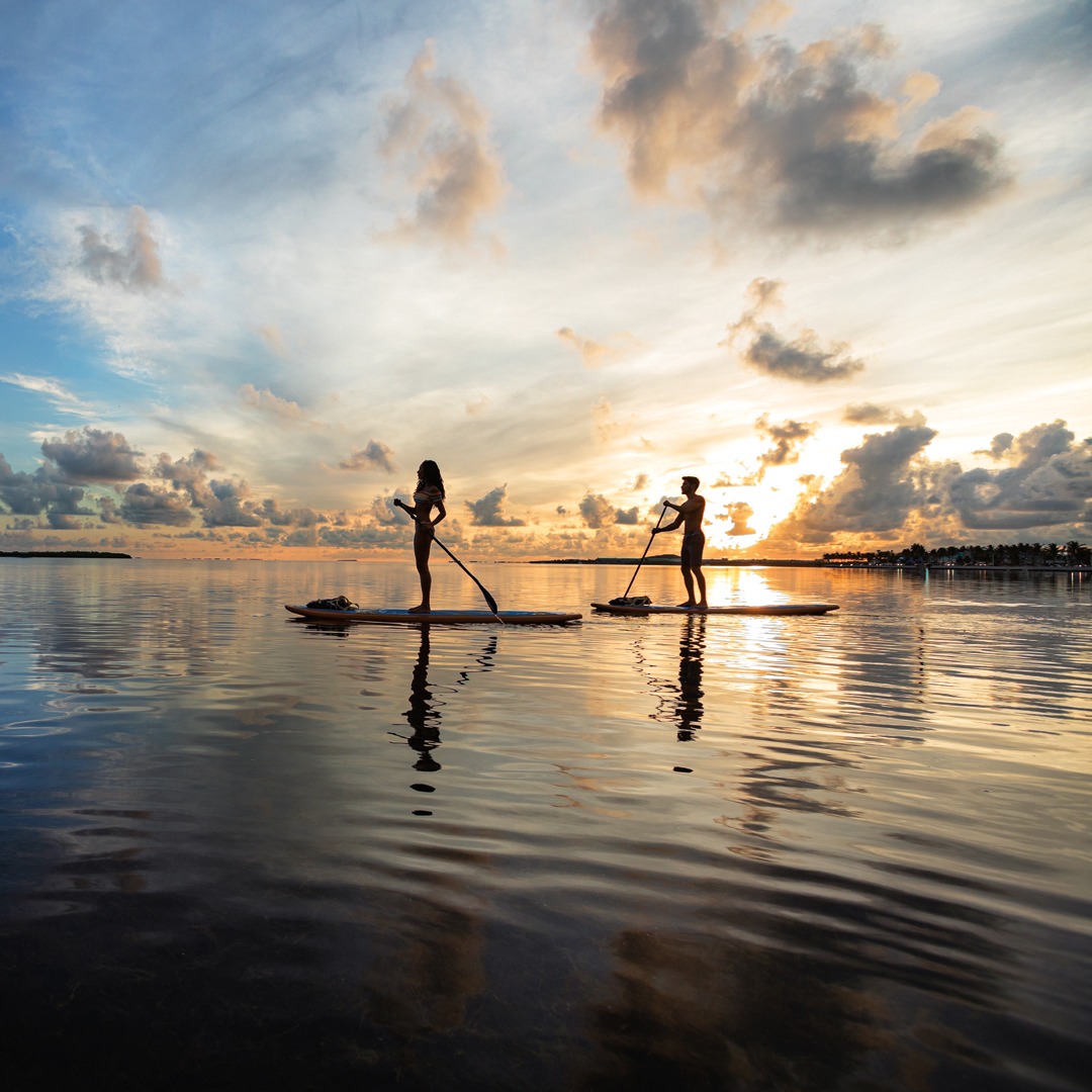 couple paddleboarding in the florida keys