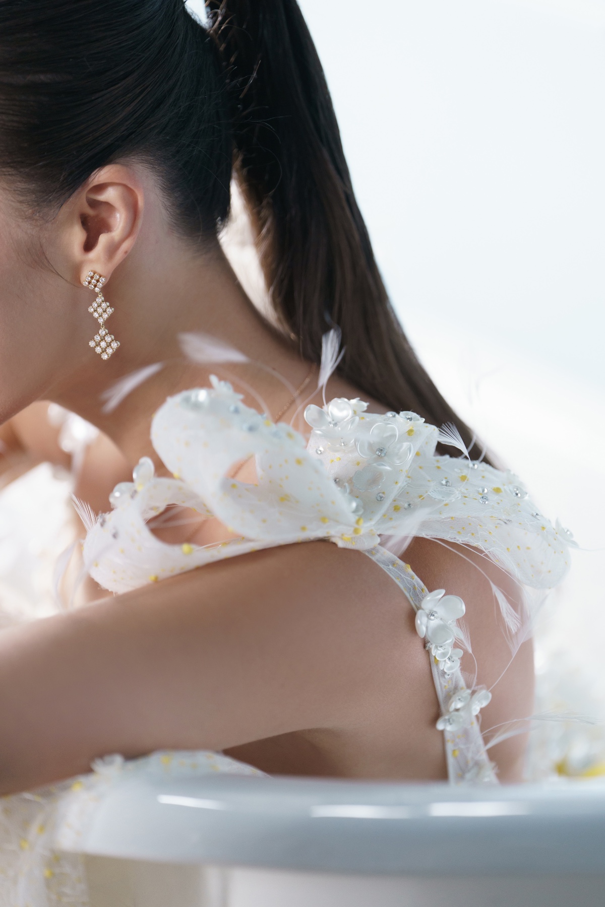 floral and feather wedding dress