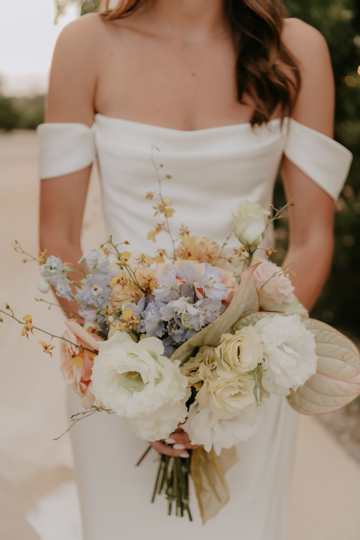 minimalist satin wedding gown with off the shoulder