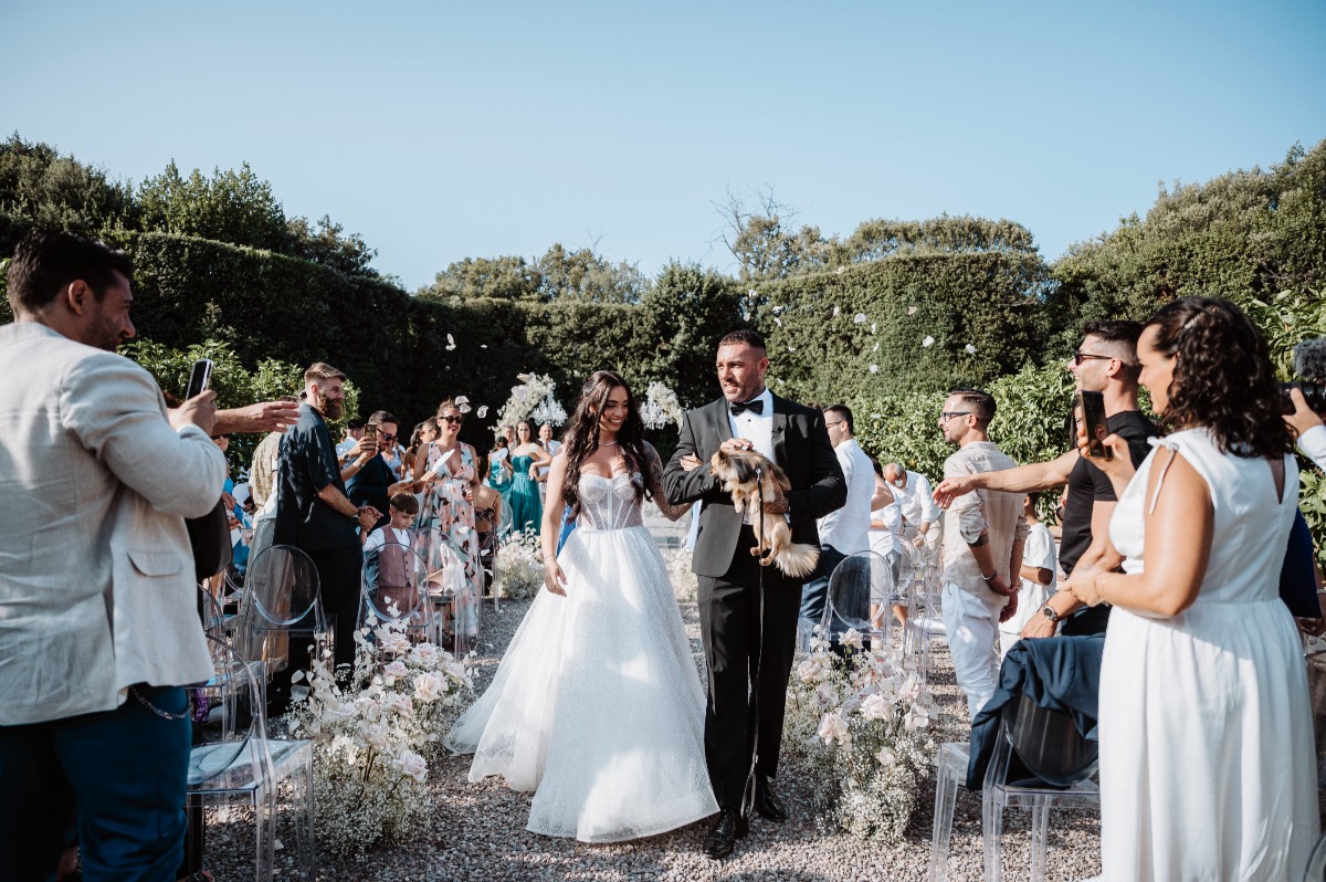 petal toss at garden wedding ceremony