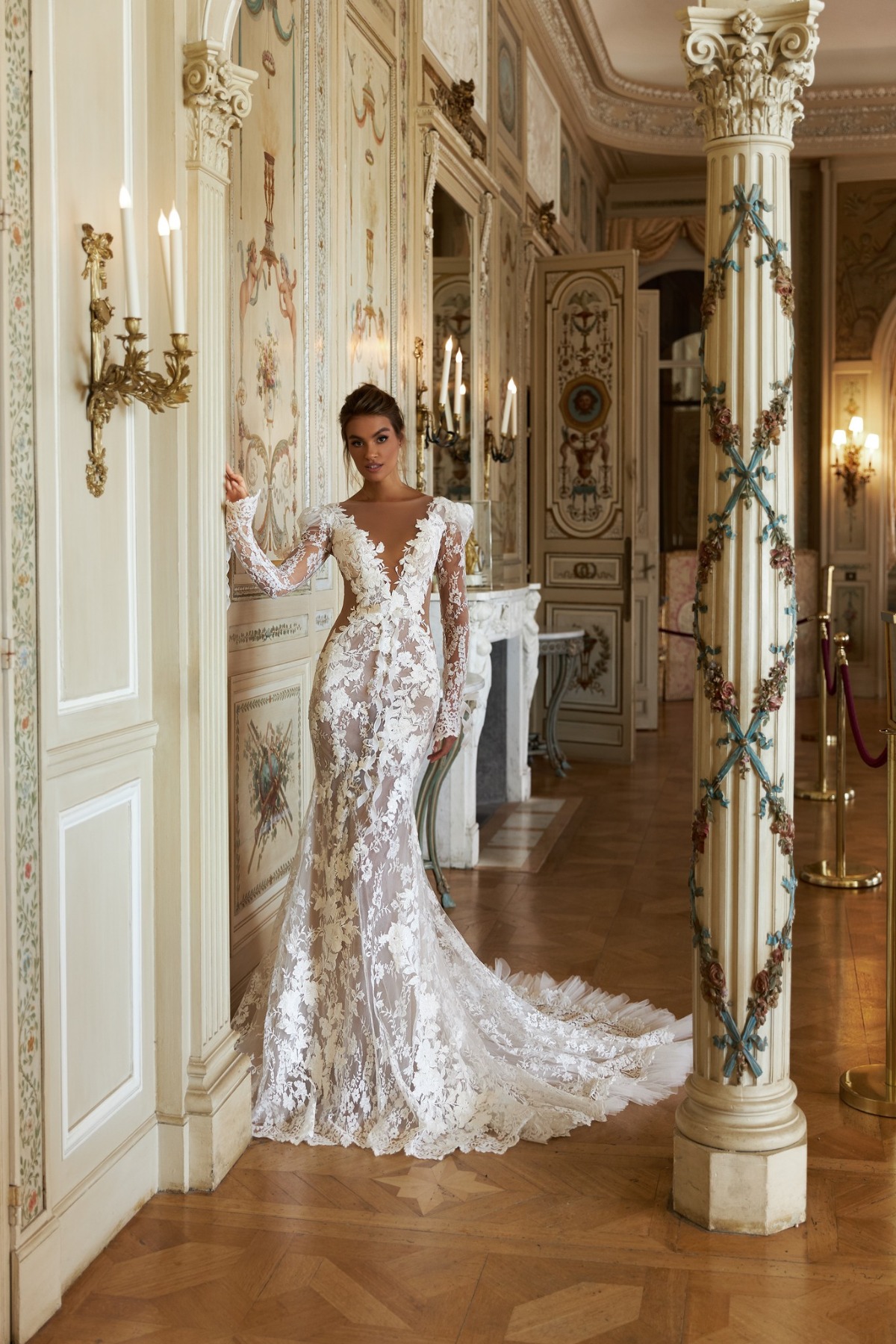 bride in long sleeve wedding gown with many details