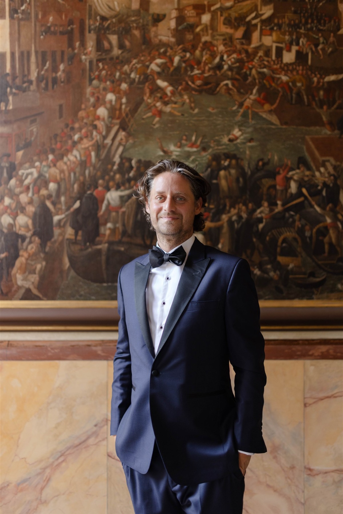 groom in blue tuxedo