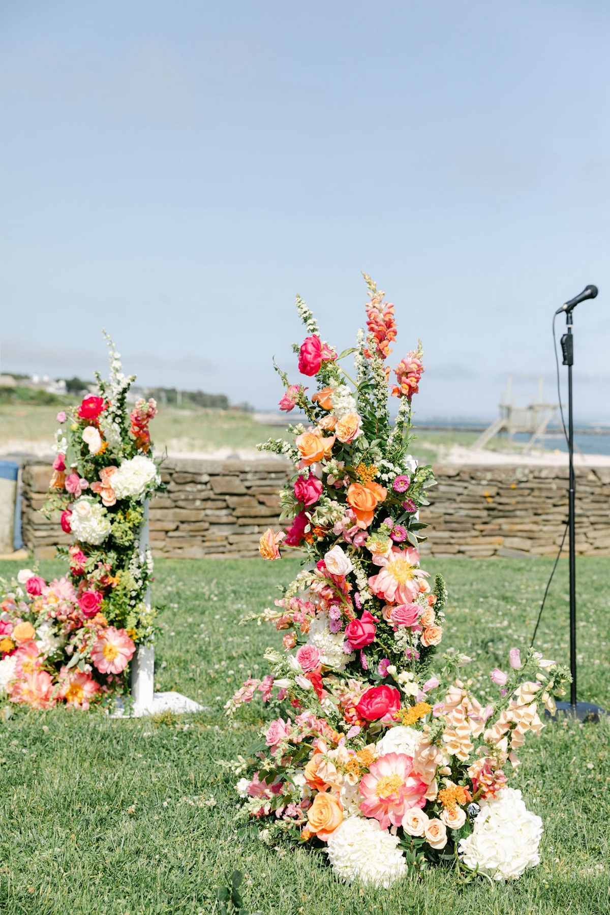 pink and orange floral arch for wedding