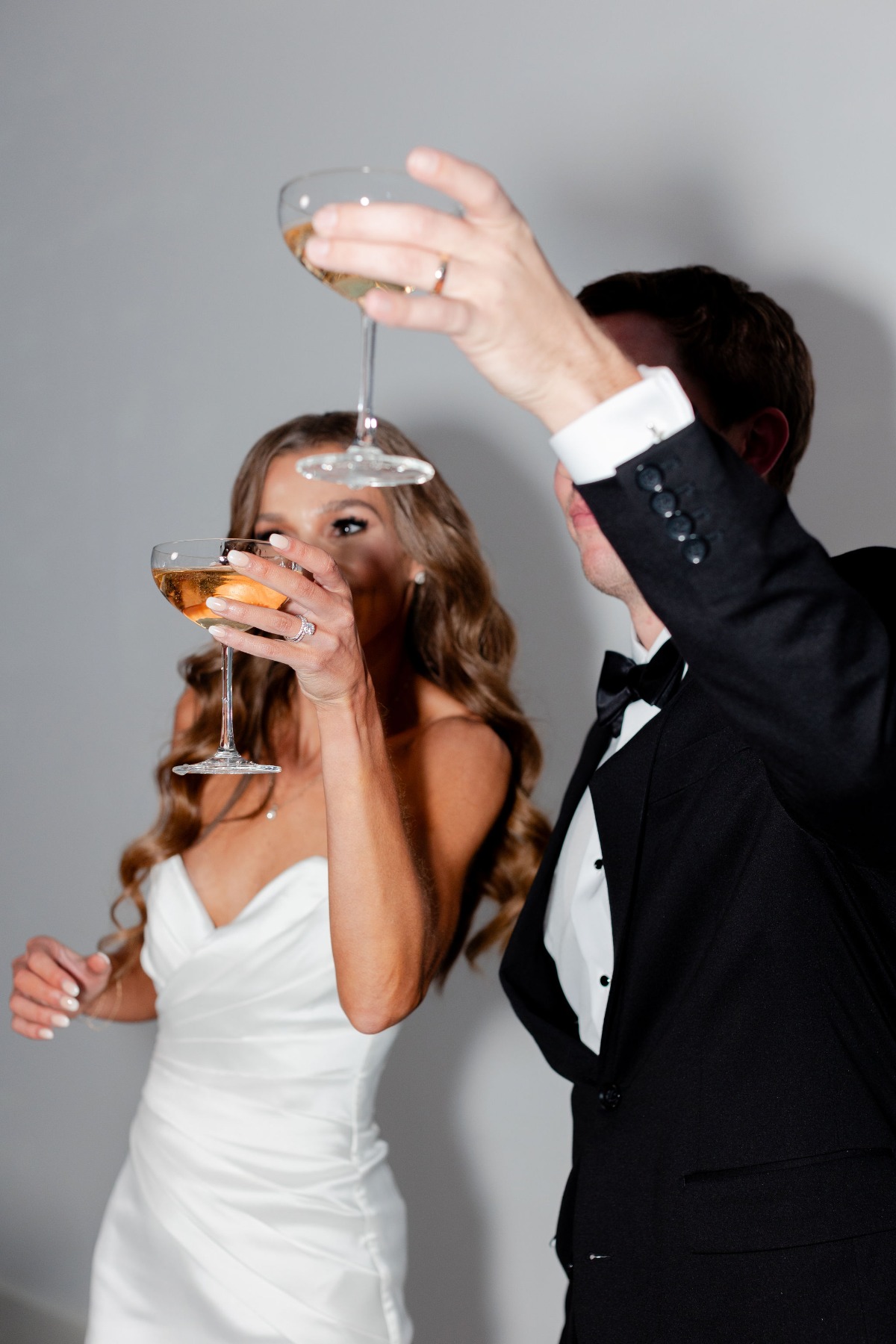 bride and groom toasting