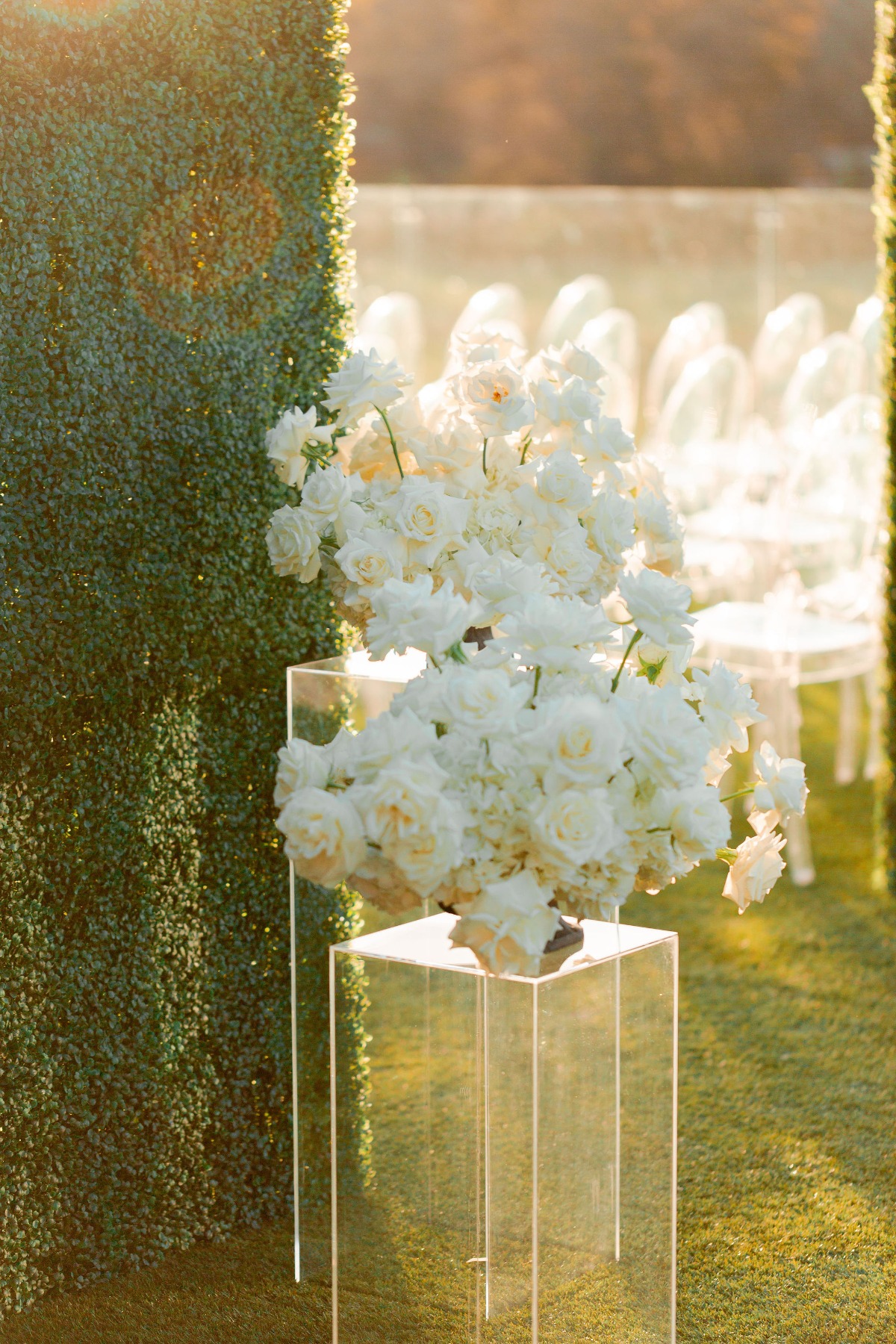 white flower arrangements with acrylic bases