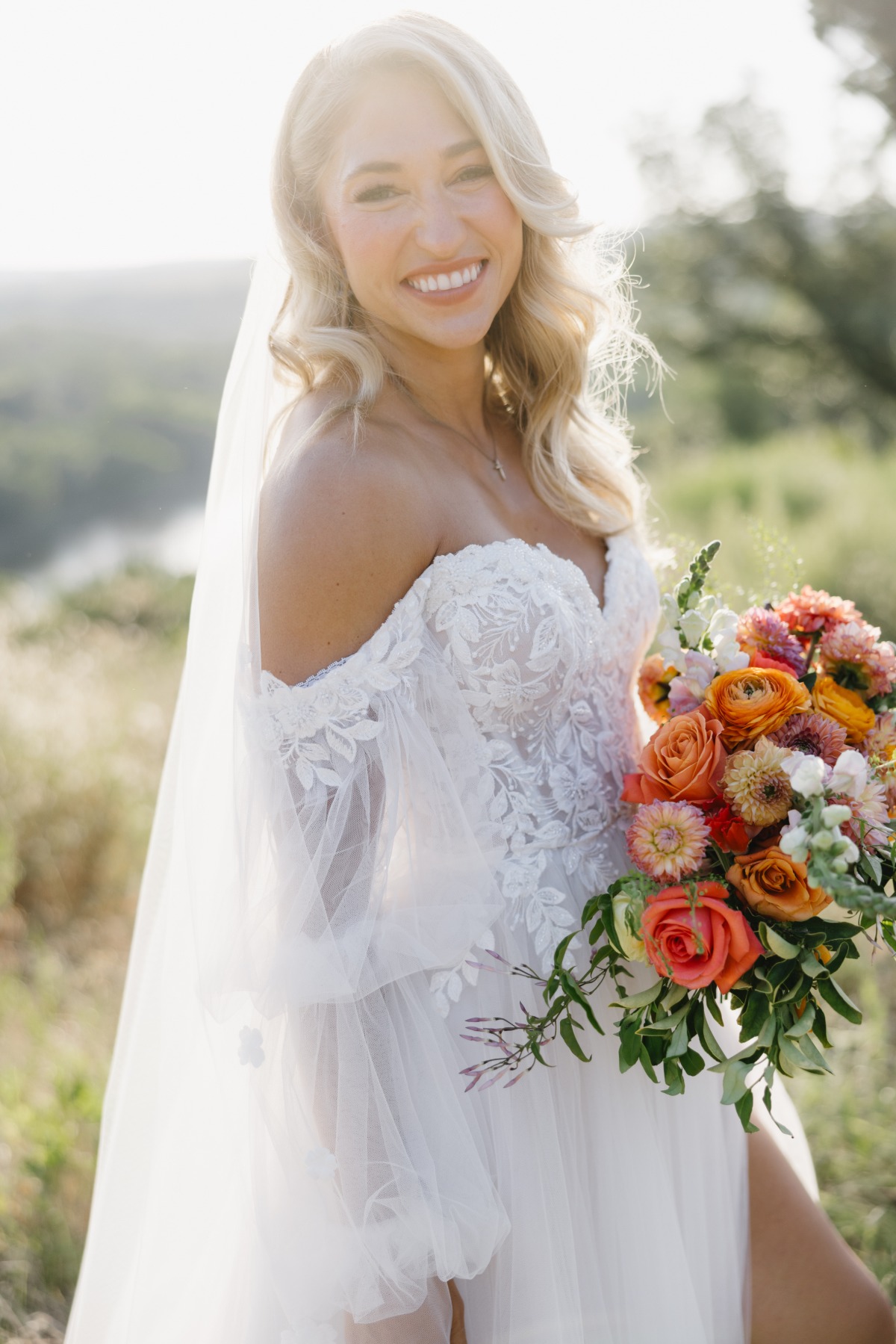 bride with orange bouquet