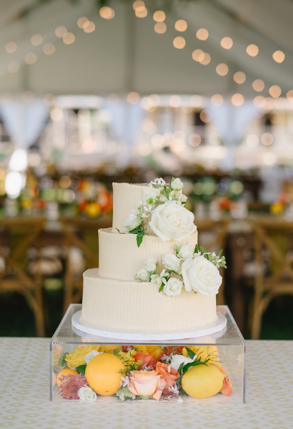 three tiered buttercream wedding cake with citrus