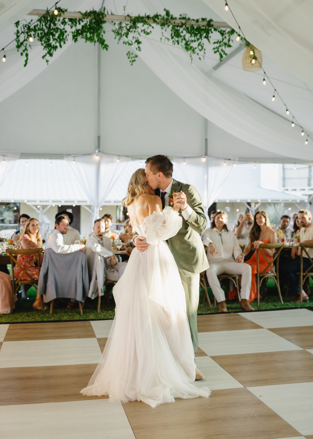 bride and groom dancing at tented reception