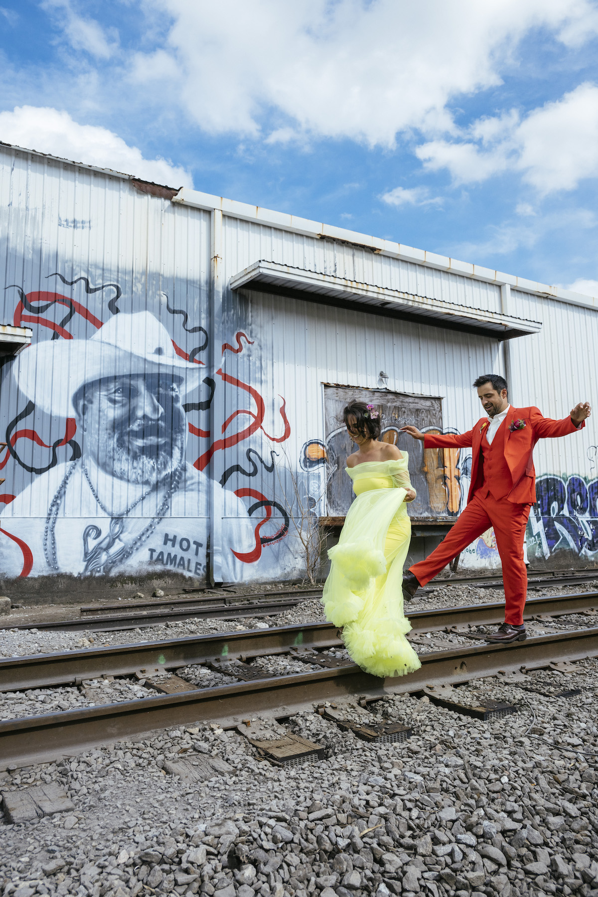 wedding portraits in front of mural