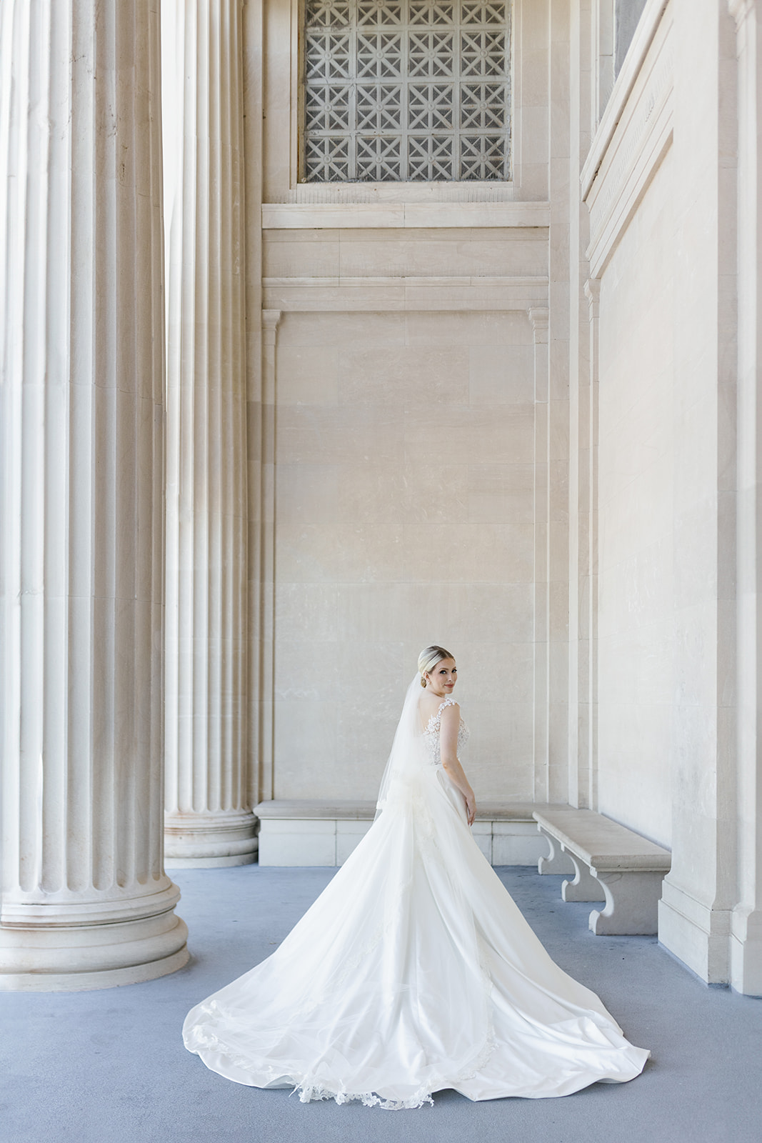 bride at museum with long train