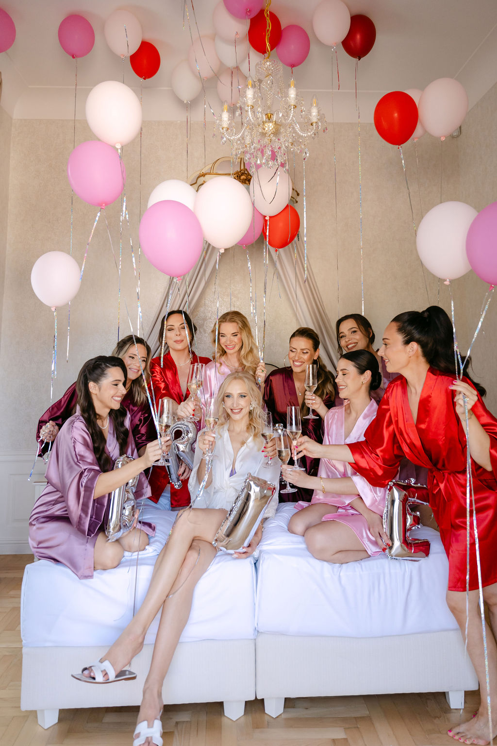 bridesmaids in pink red and purple robes