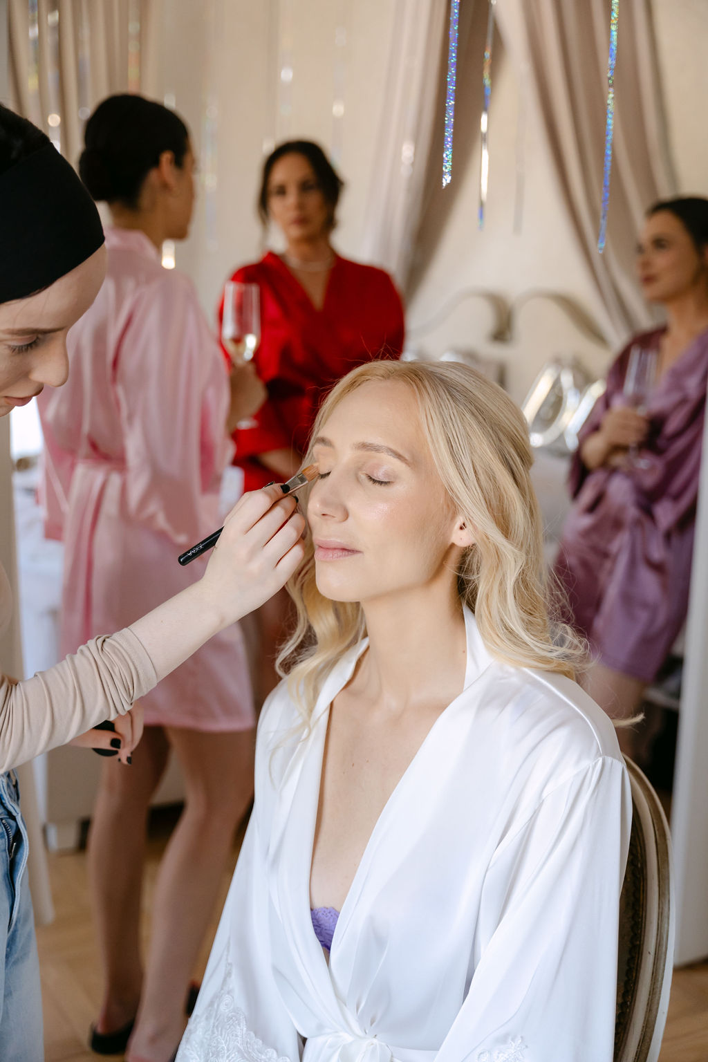 bride getting her makeup done