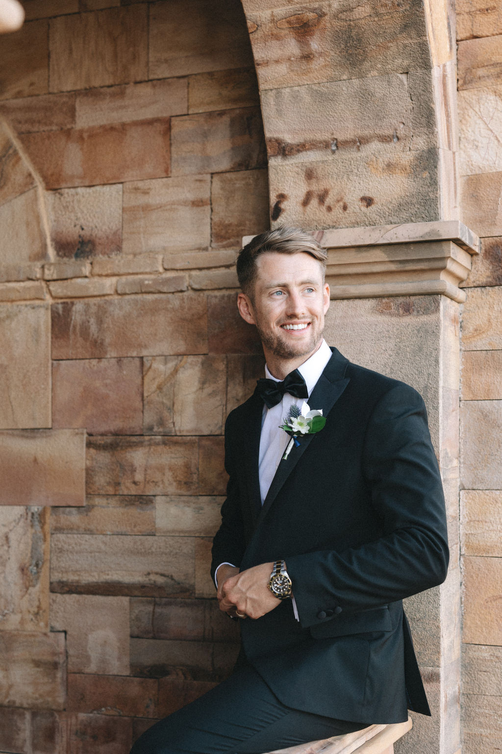 groom in black suit