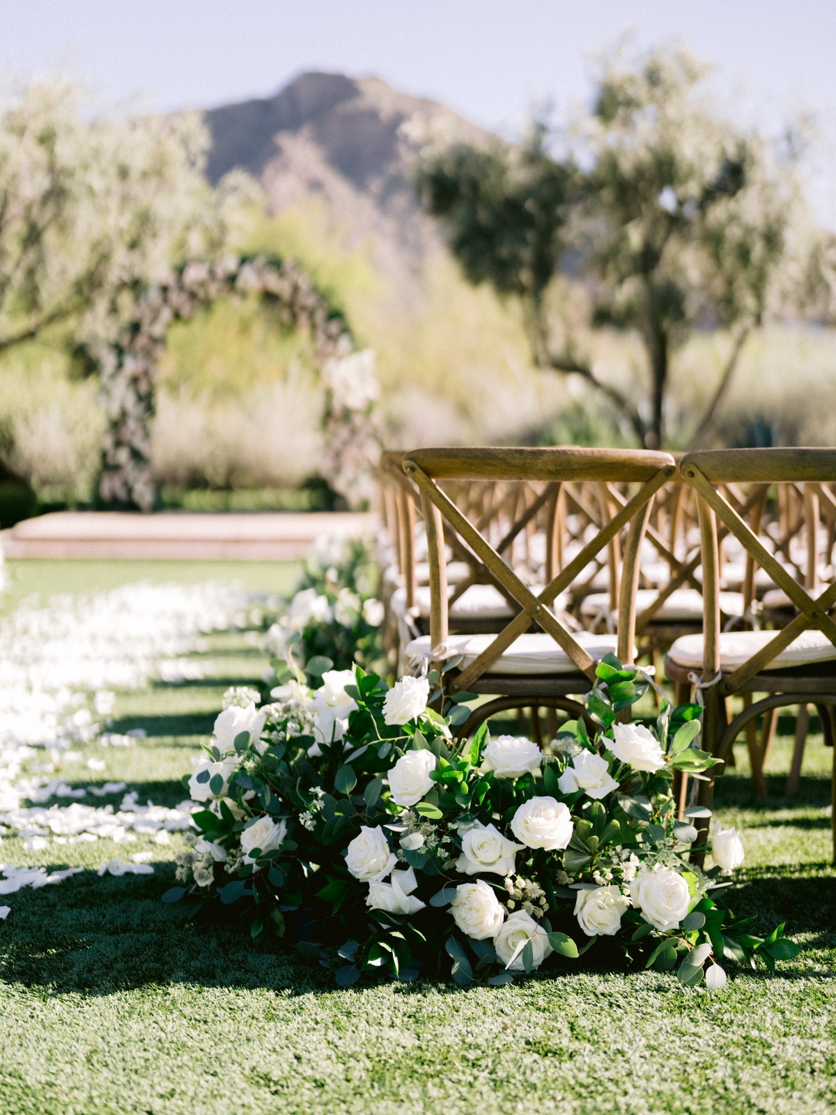 white rose floor level arrangements for wedding ceremony