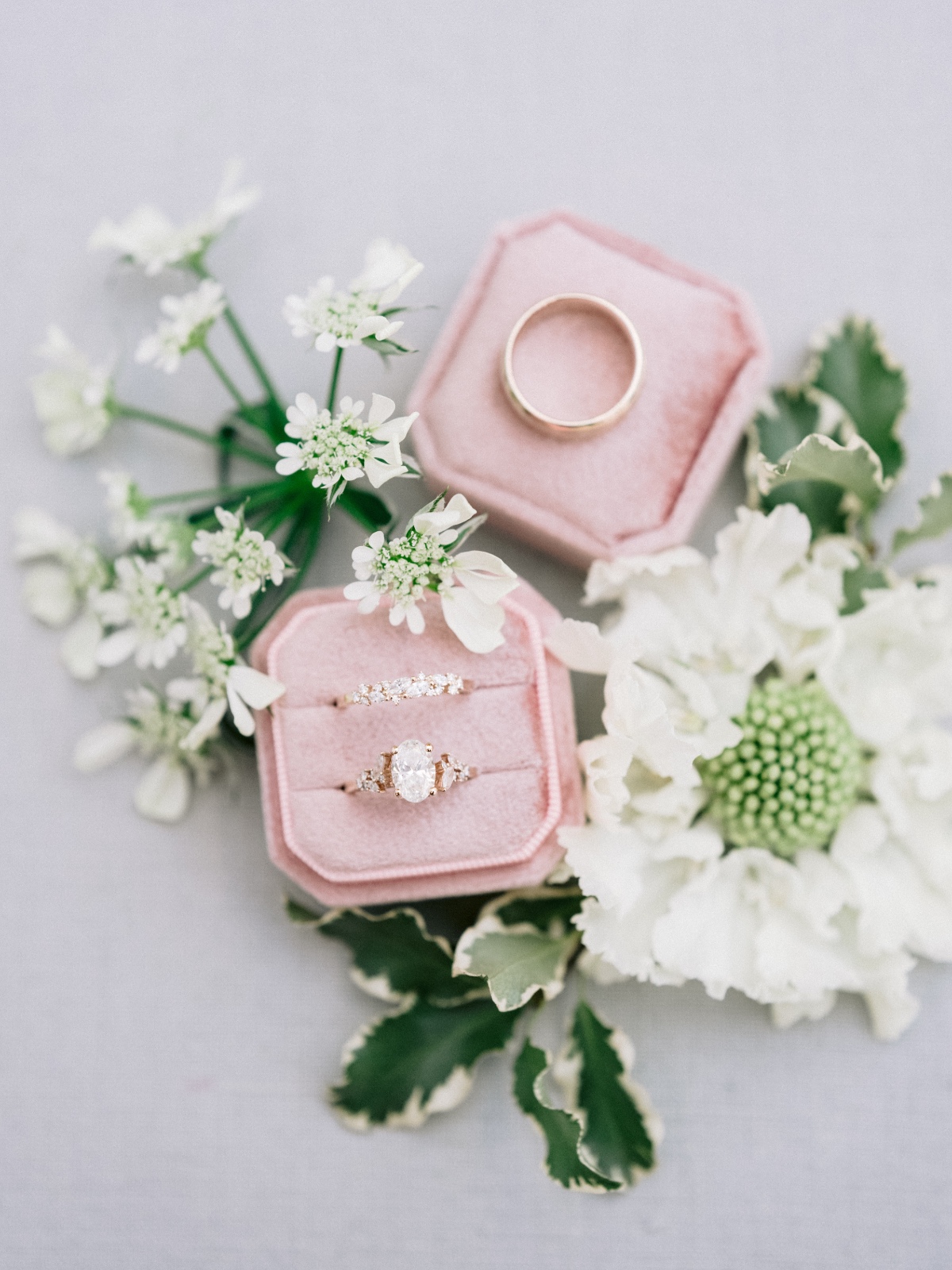 blush ring box with oval diamond ring