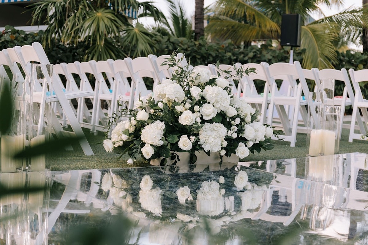 mirrored wedding aisle and white flowers