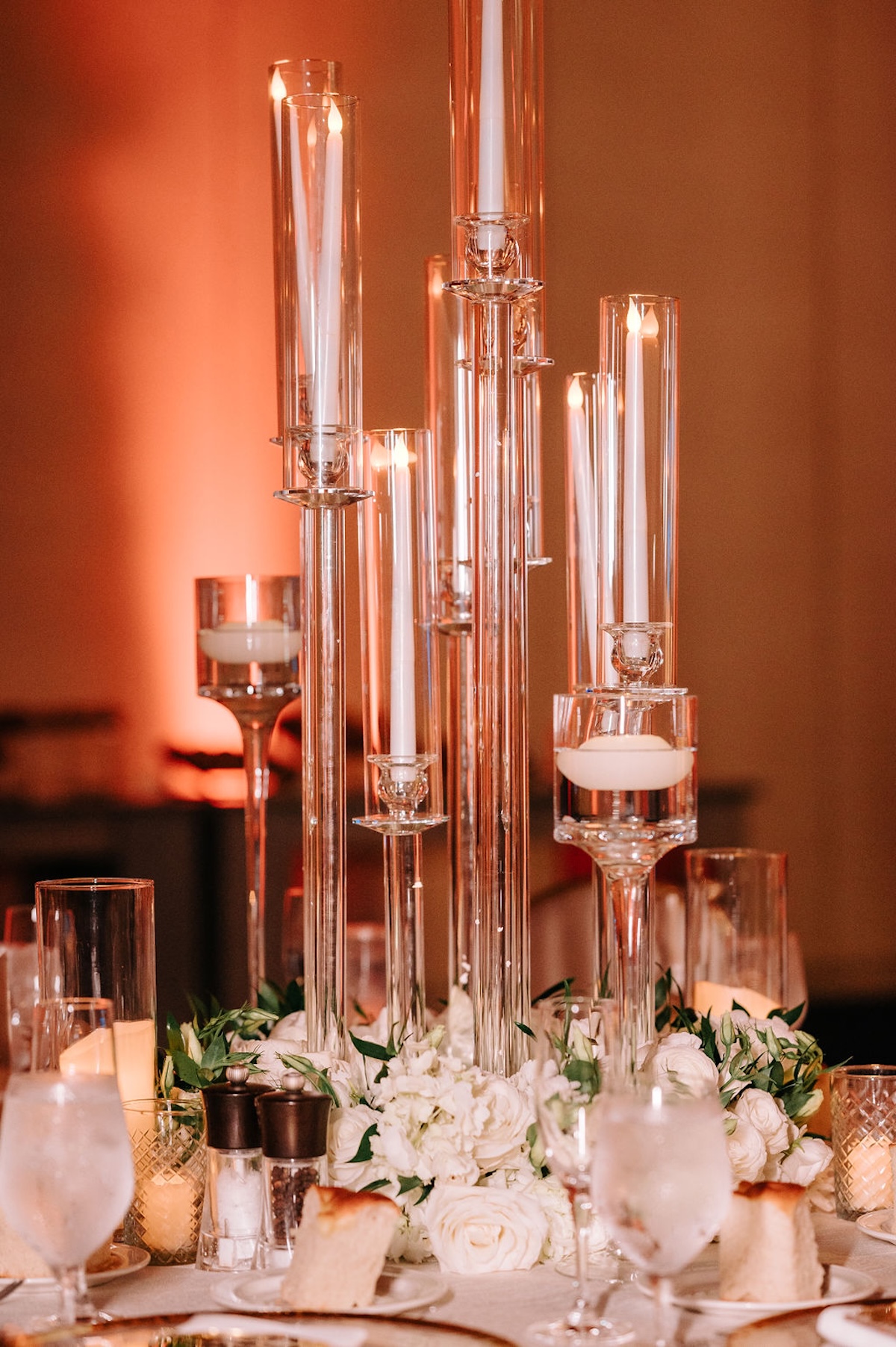 tapered glass hurricane vases and candles for ballroom wedding