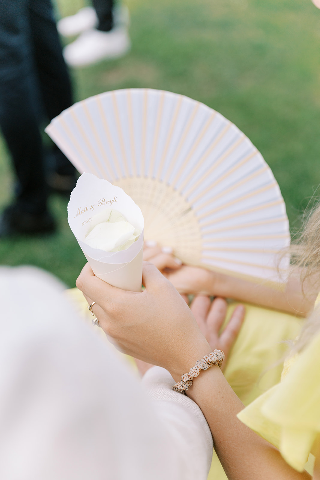 flower petal holders and fans for outdoor wedding ceremony